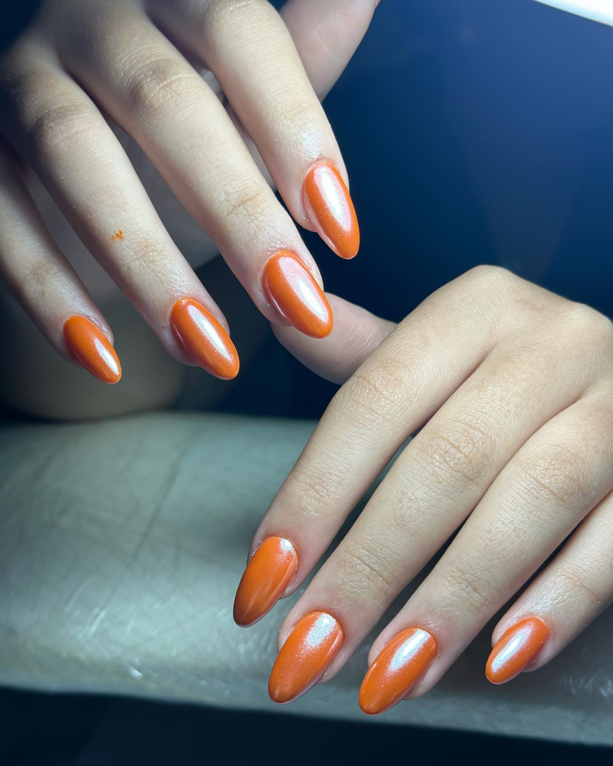 orange chrome nail design