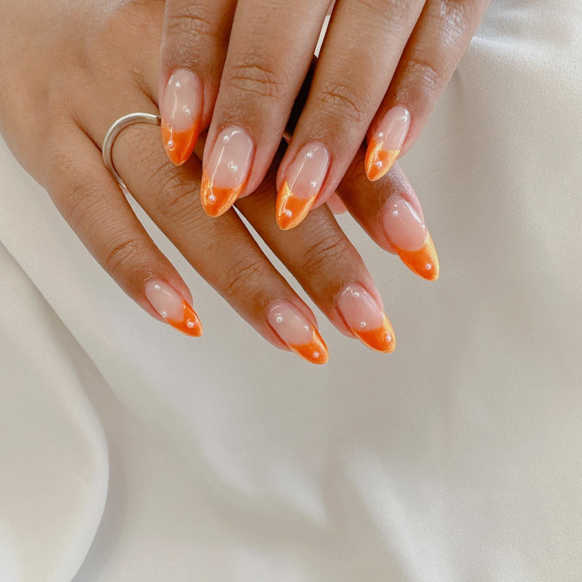 orange french tip with pearls