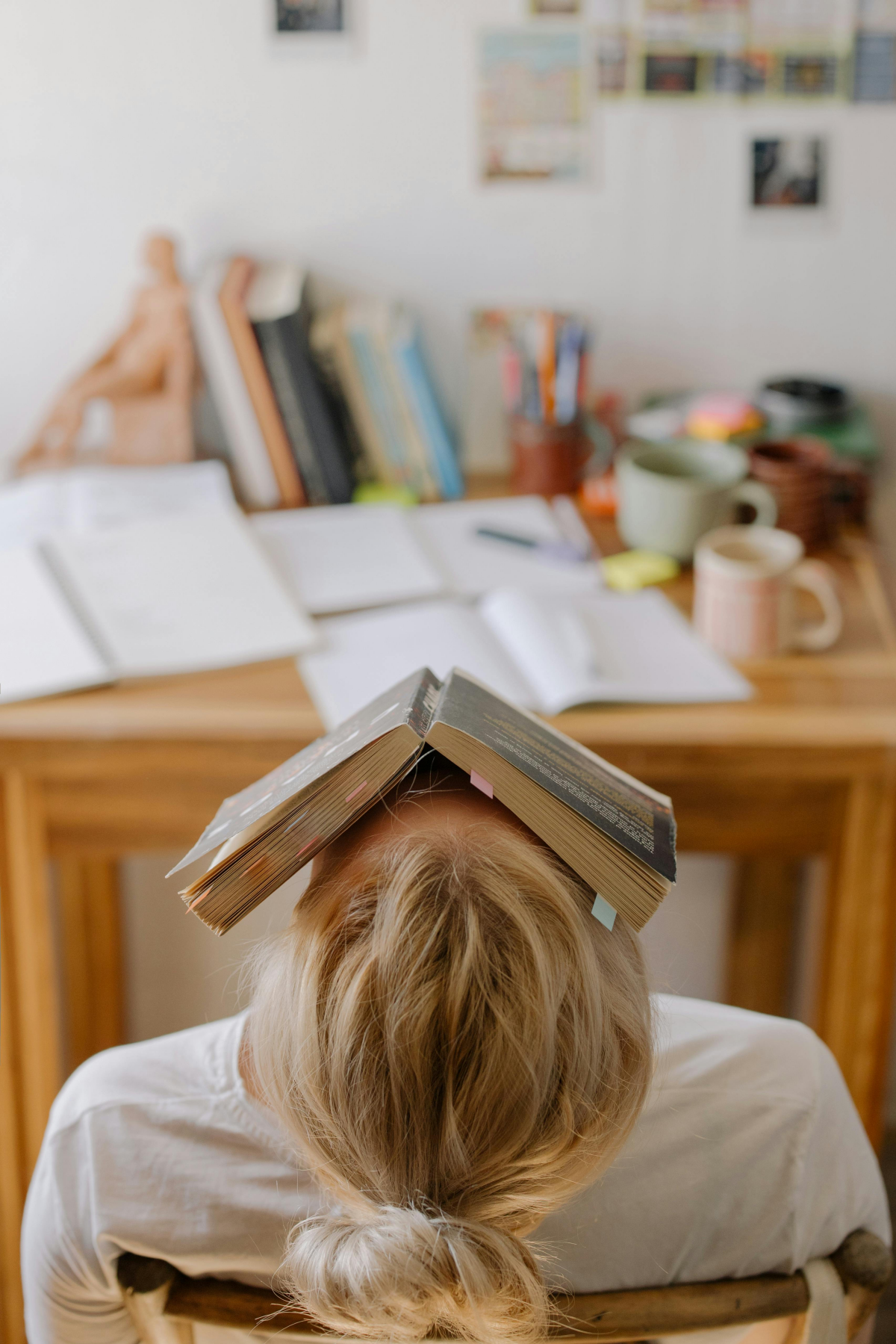 person with book on head