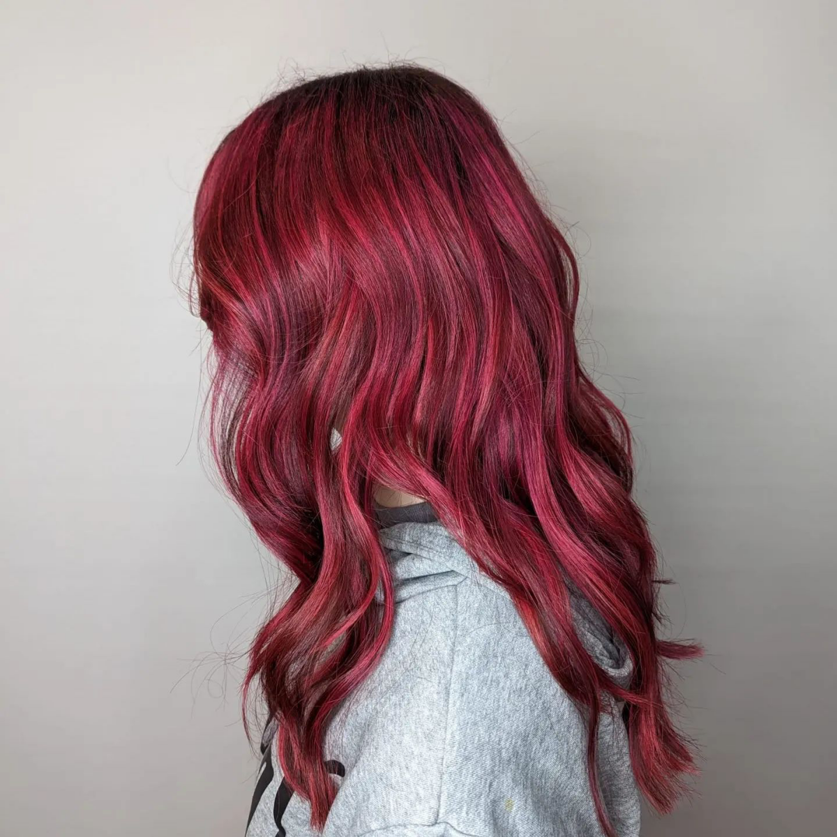 pink and red hair woman with long red and pink hair