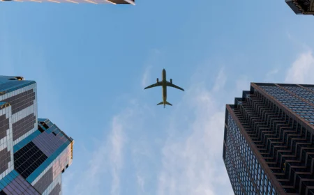 plane flying over the city