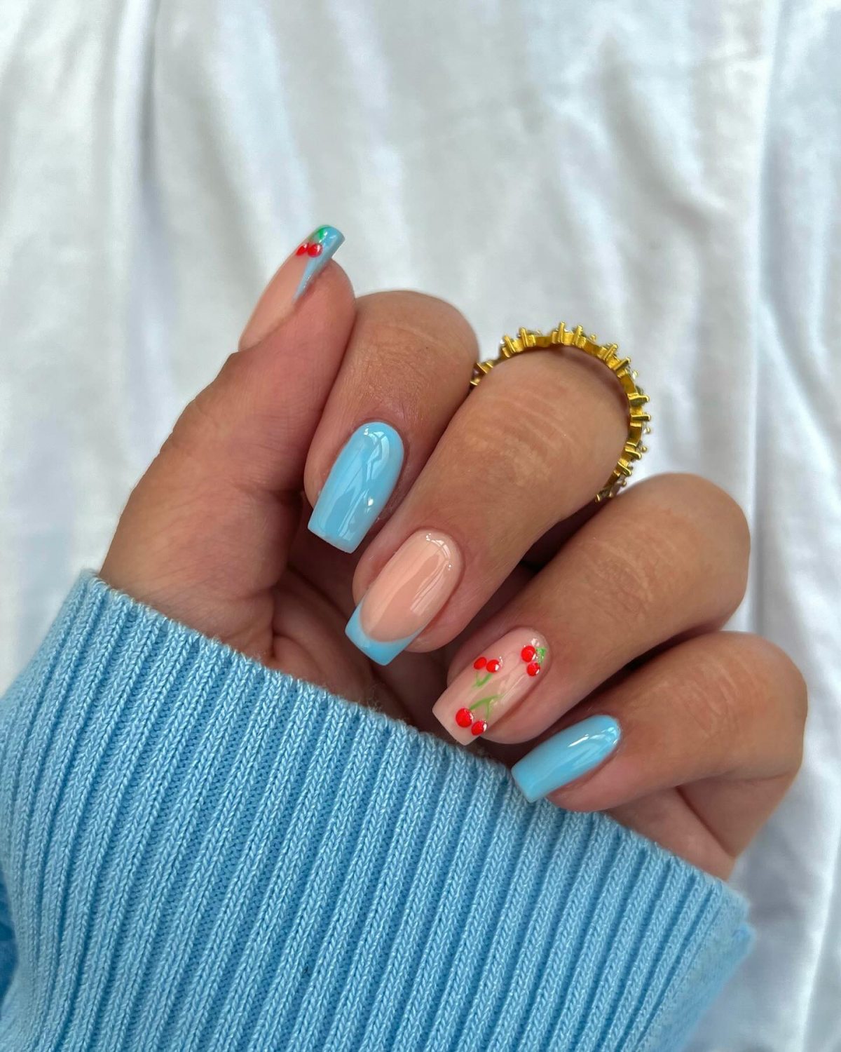 sky blue nails with cherries