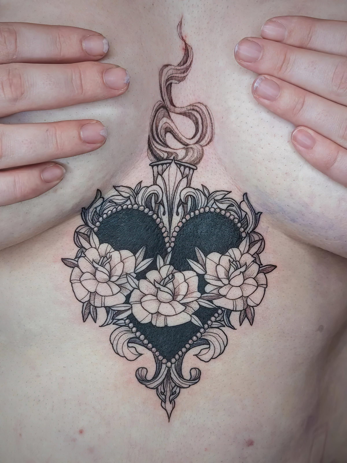 sternum between breast tattoos