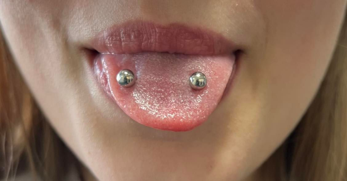 venom bites tongue piercing