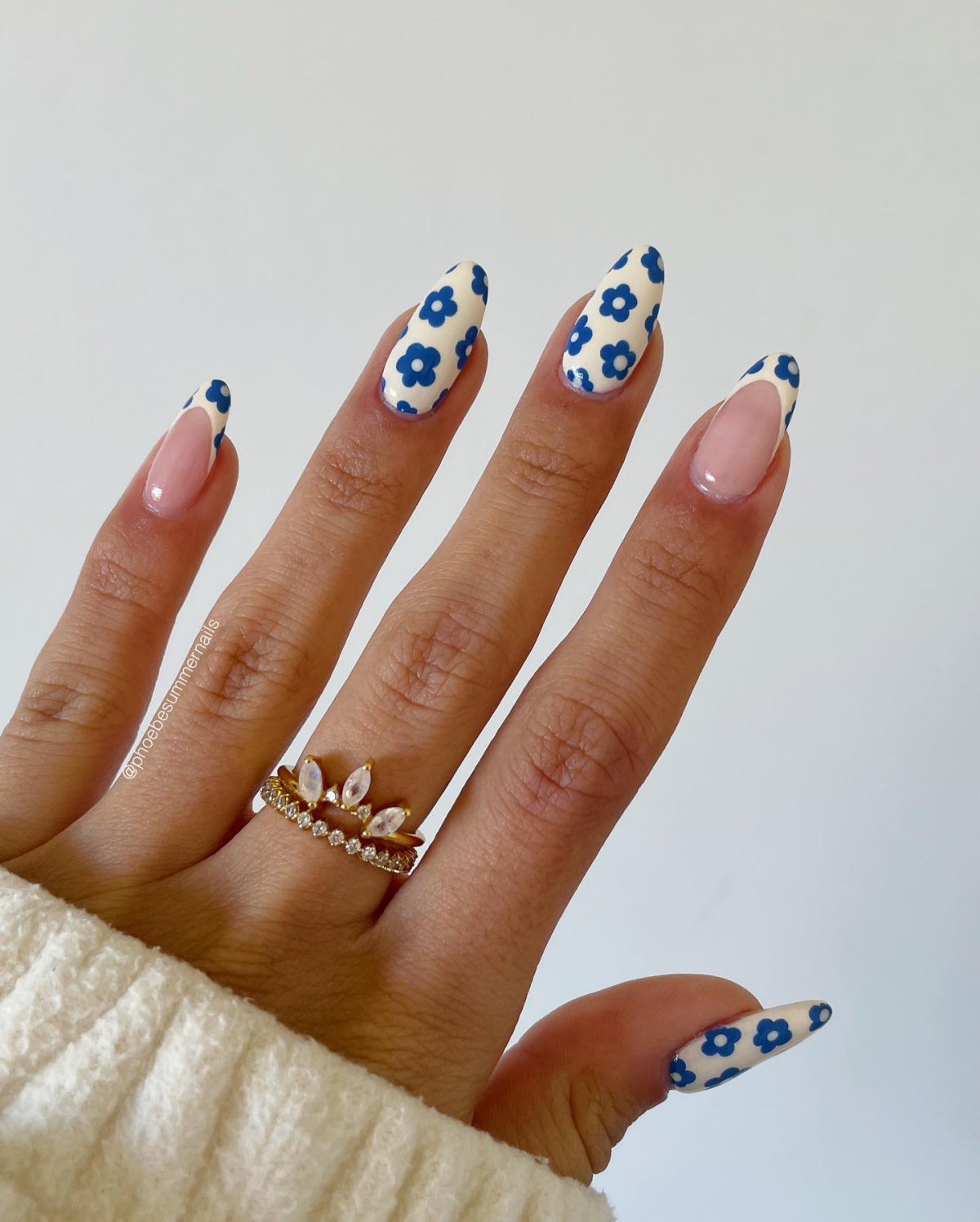 white and blue flowers on nails