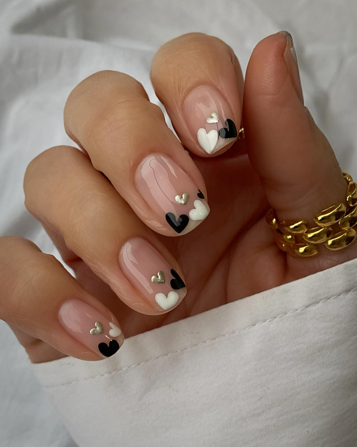 white black and gold hearts on nails
