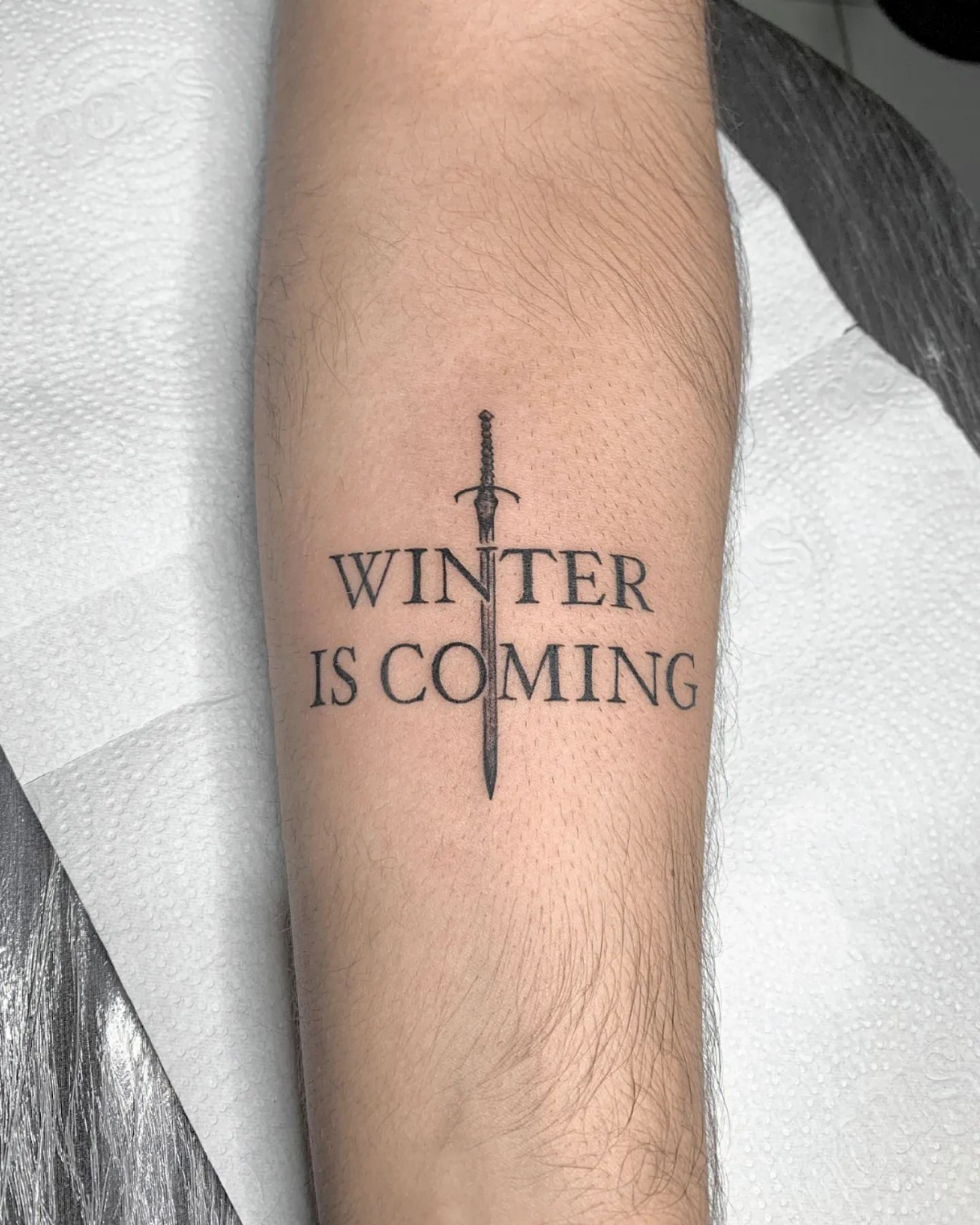 winter is coming tattoo with sword
