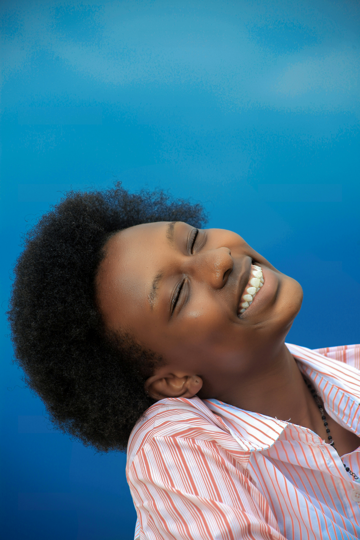 woman smiling on blue background