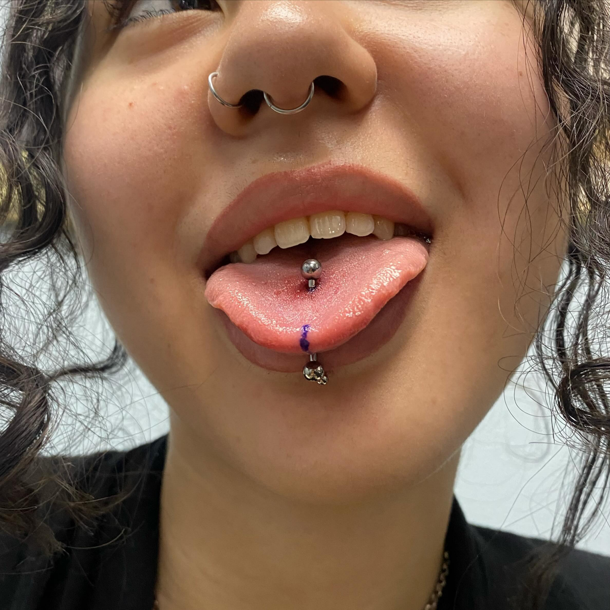woman with classic tongue piercing