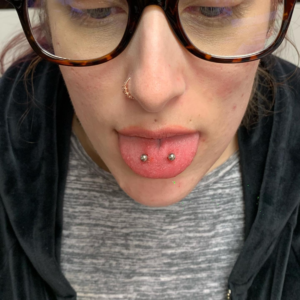 woman with horizontal tongue piercing