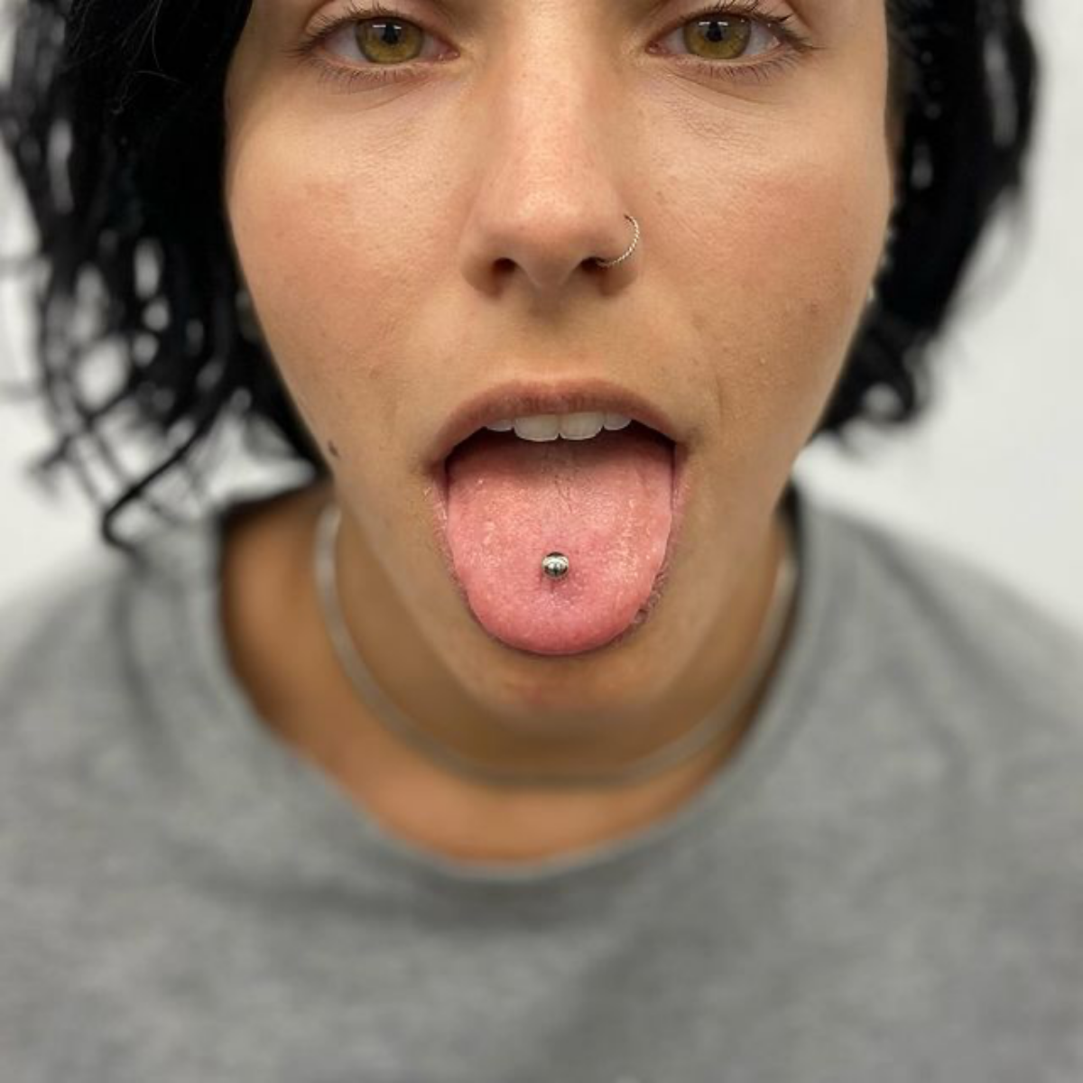 woman with pierced tongue