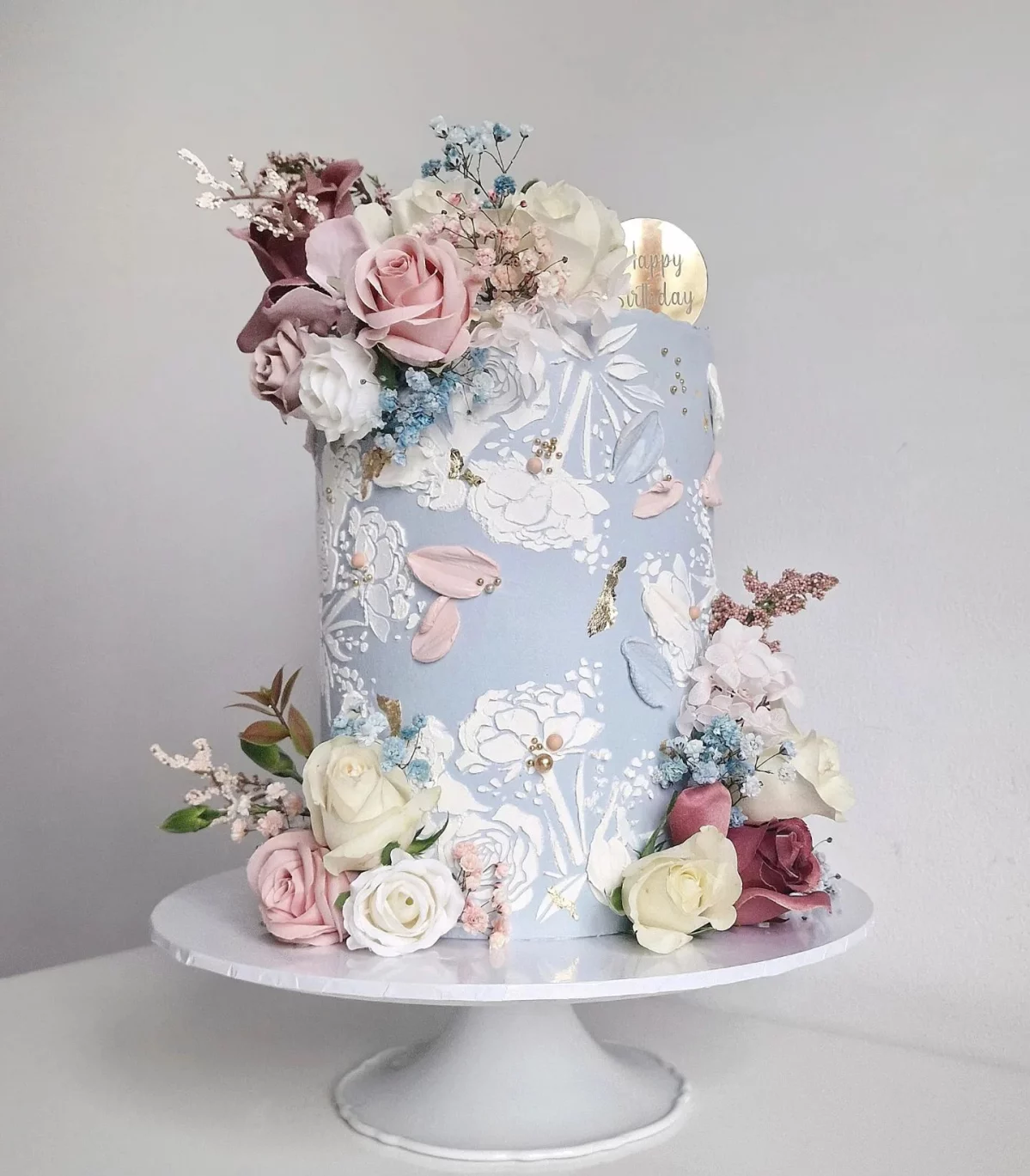 baby blue cake with flowers