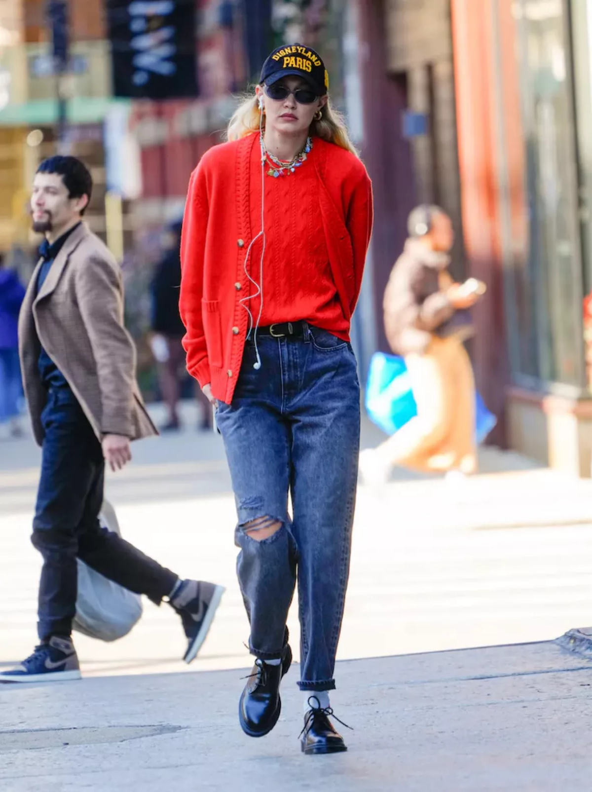 gigi hadid red sweater and oxford shoes