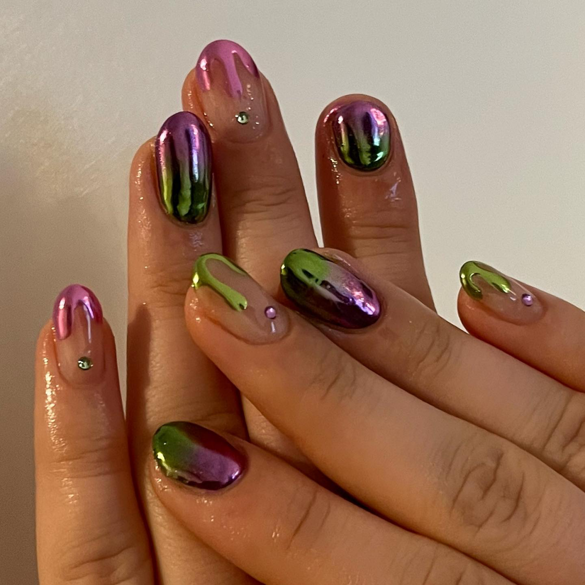 green and purple chrome nails