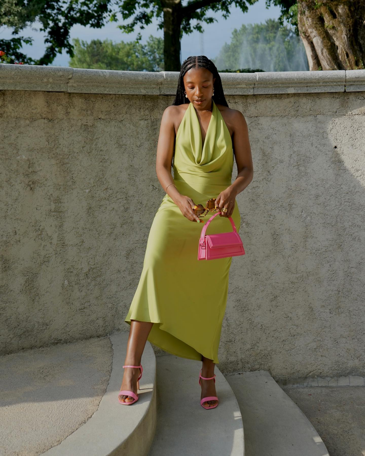 green dress with pink bag and pink shoes