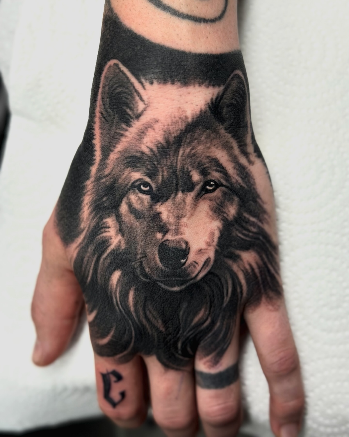 hand wolf tattoo