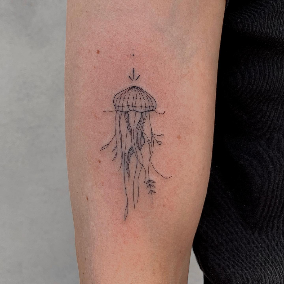 jellyfish tattoo on arm