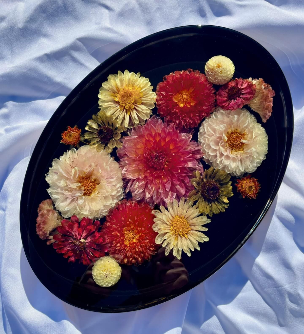resin flower preservation flowers on black tray