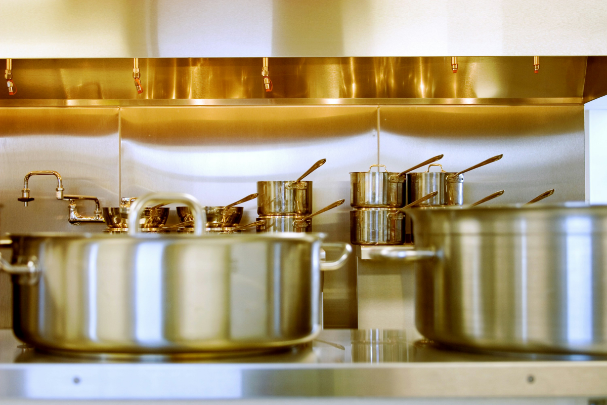 stainless steel pots and pans on counter
