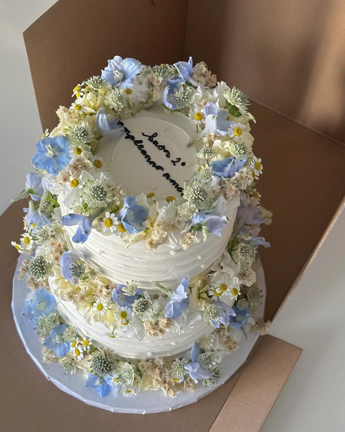 three tier cake with flowers