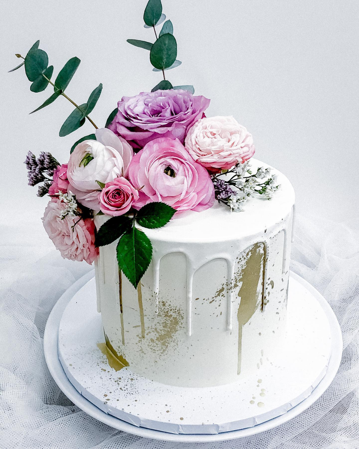 white melting cake with flowers