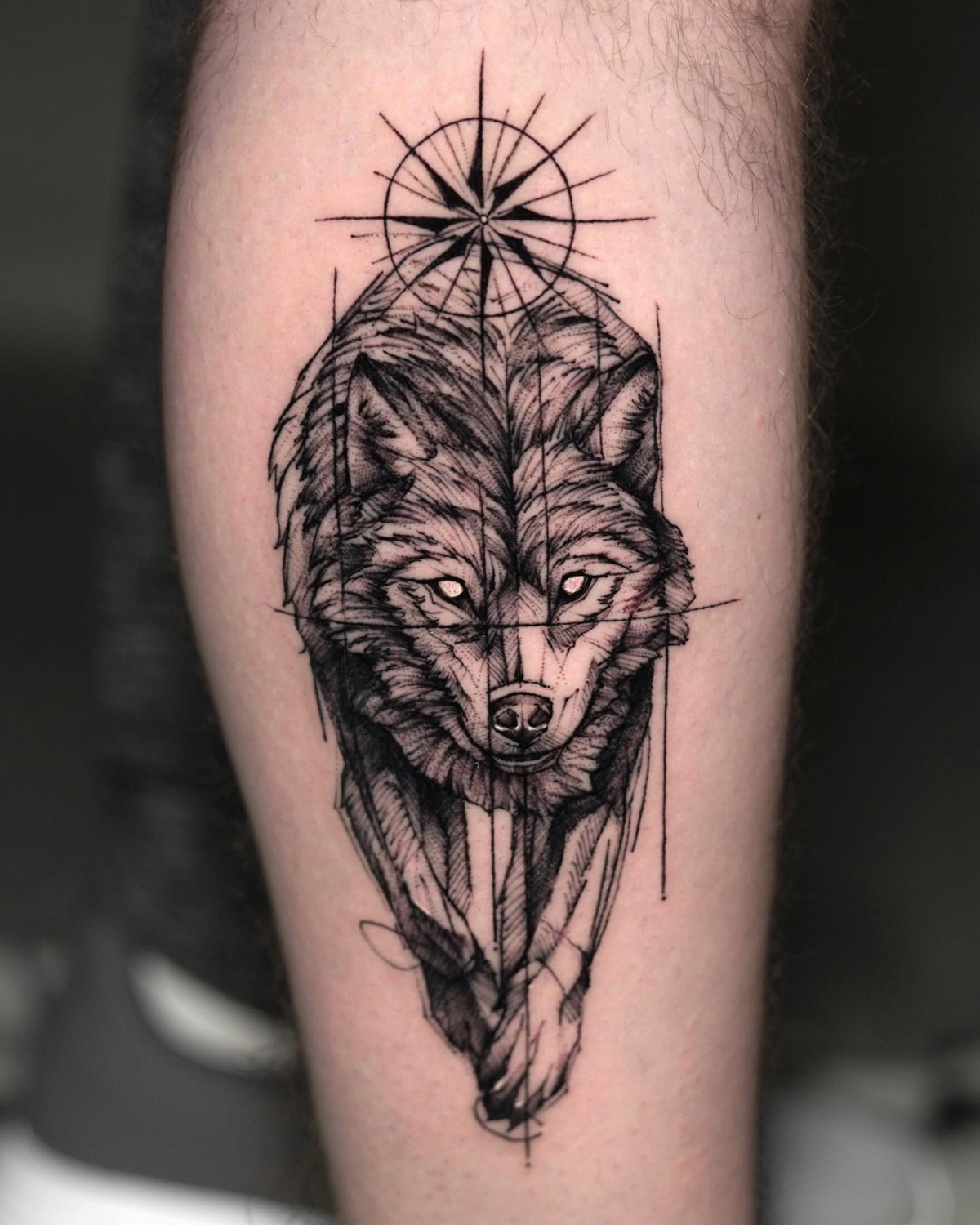 wolf and a compass tattoo