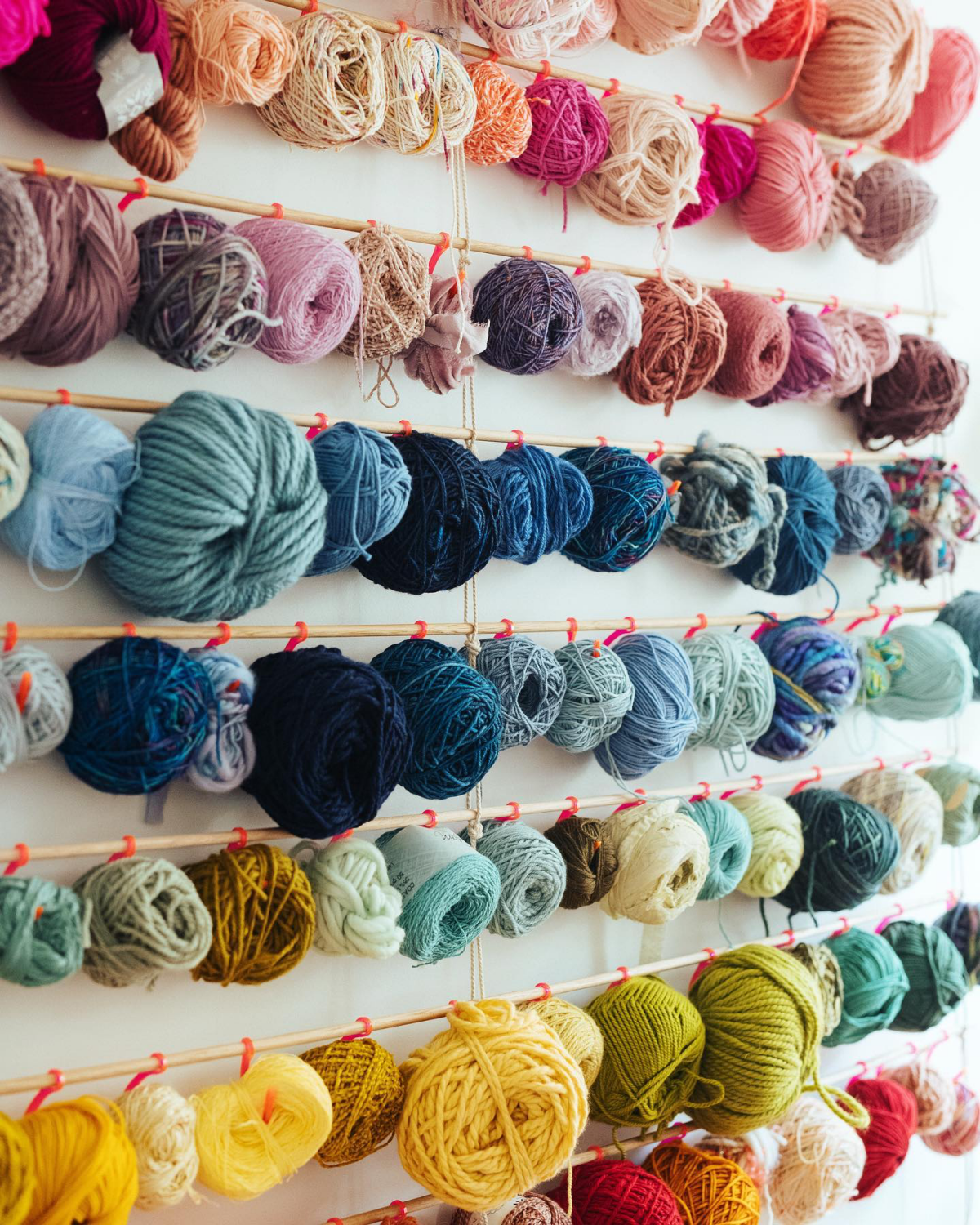 yarn storage balls of yarn on wall
