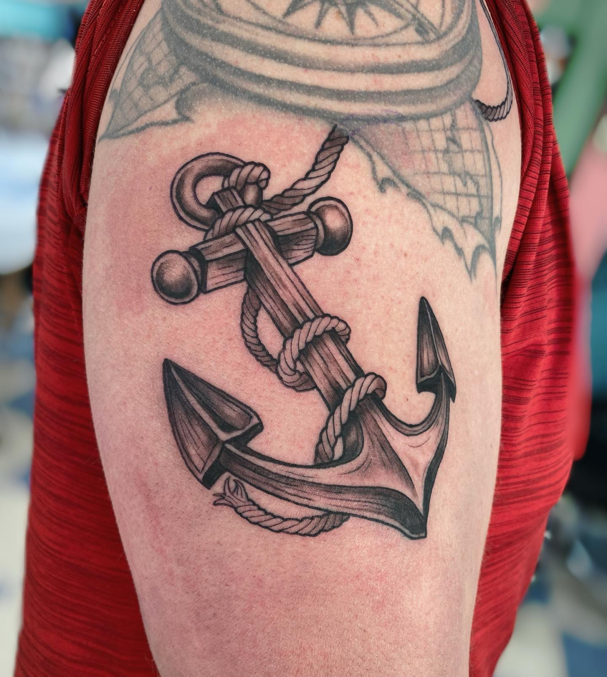 anchor with a rope tangled in it tattoo