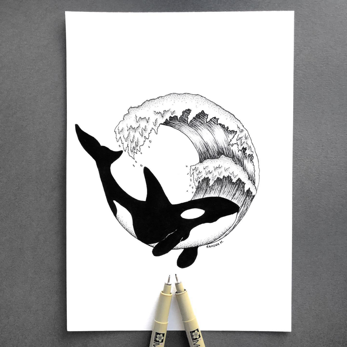 black and white whale and wave