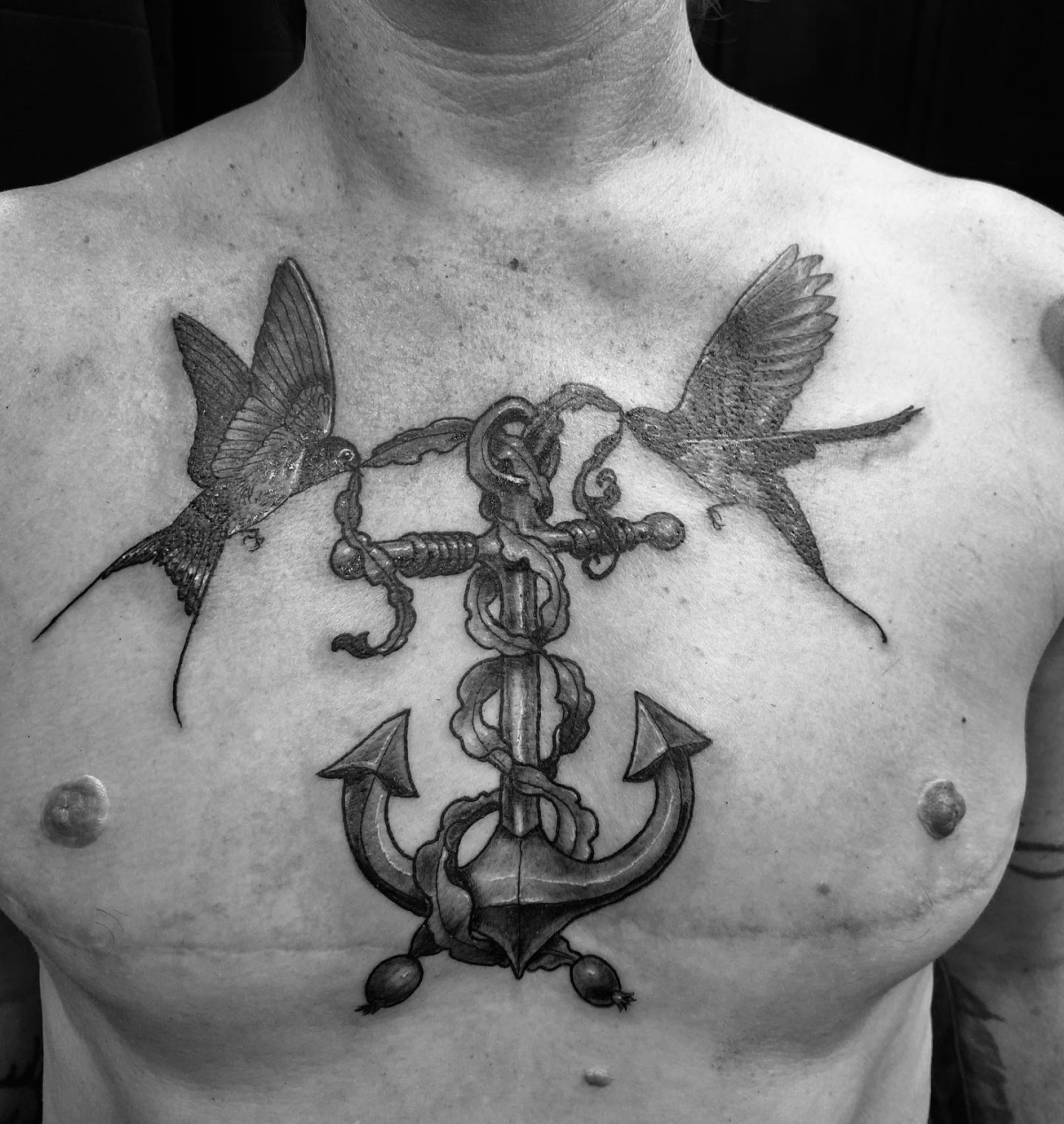 chest tattoo of an anchor