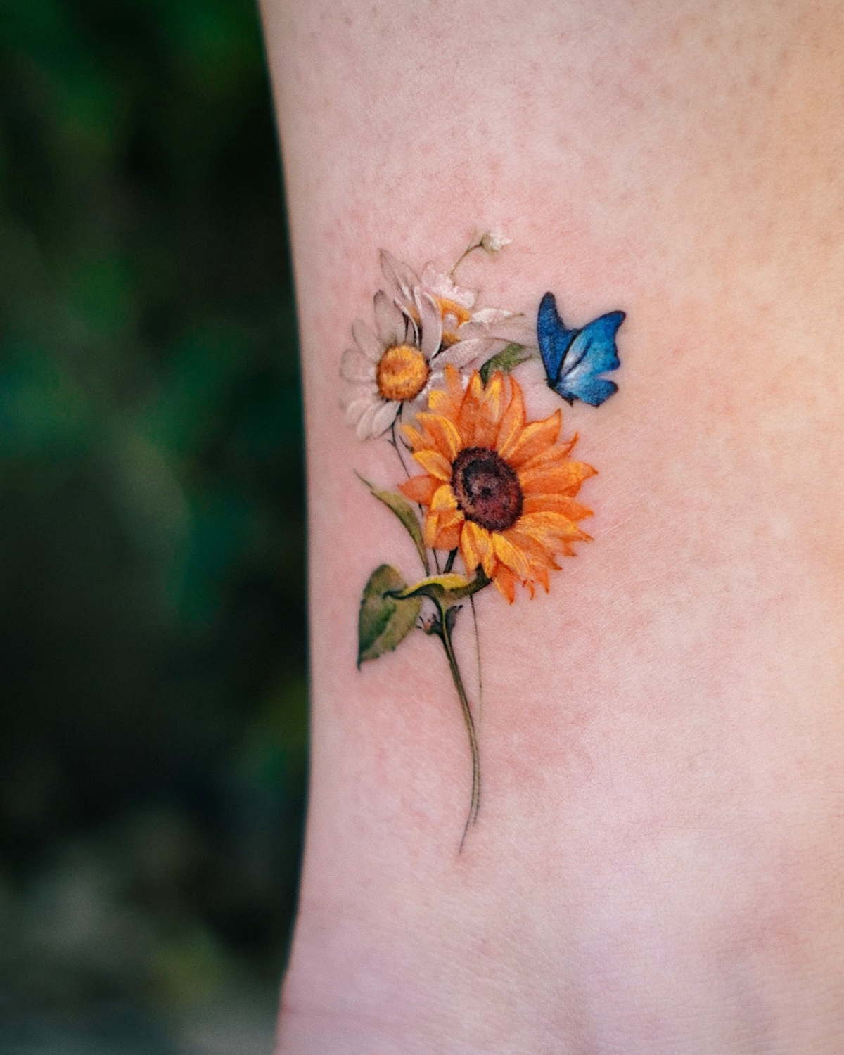 colorful sunflower and daisy tattoo