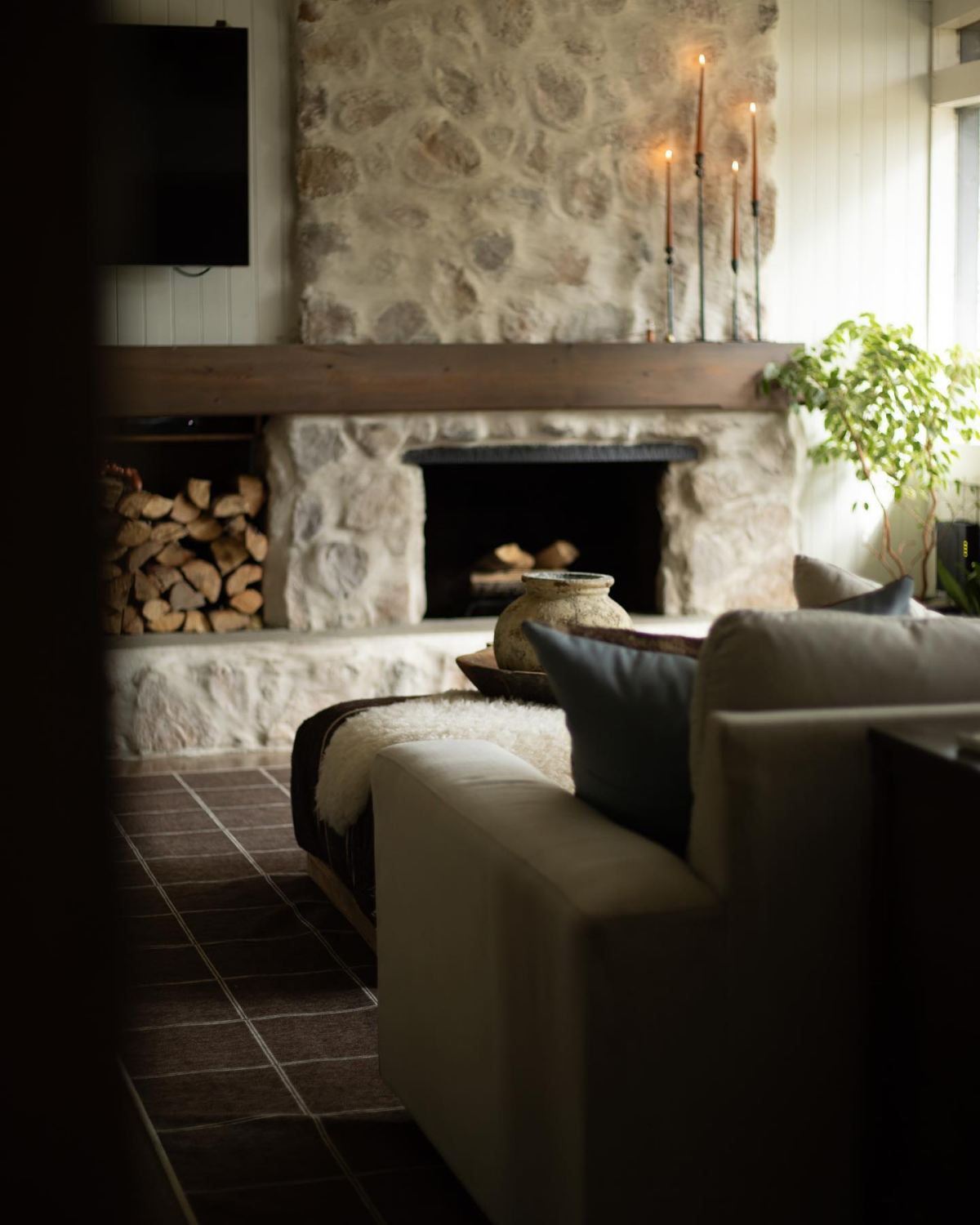 cozy stone fireplace in living room