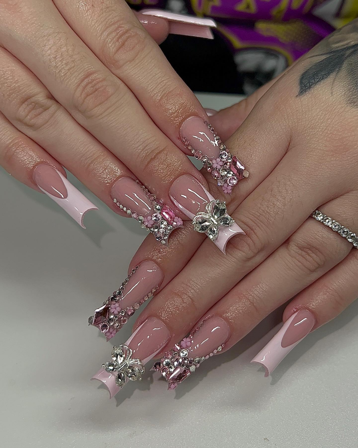 extravagant nails in pink with rhinestones nails