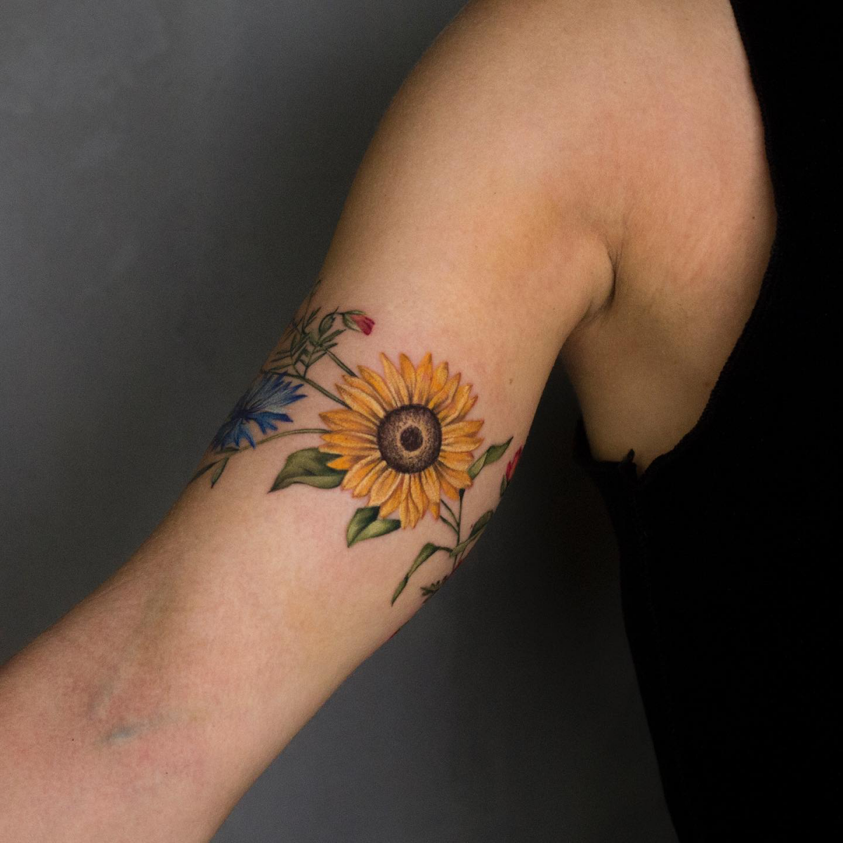 floral armband tattoo with sunflower