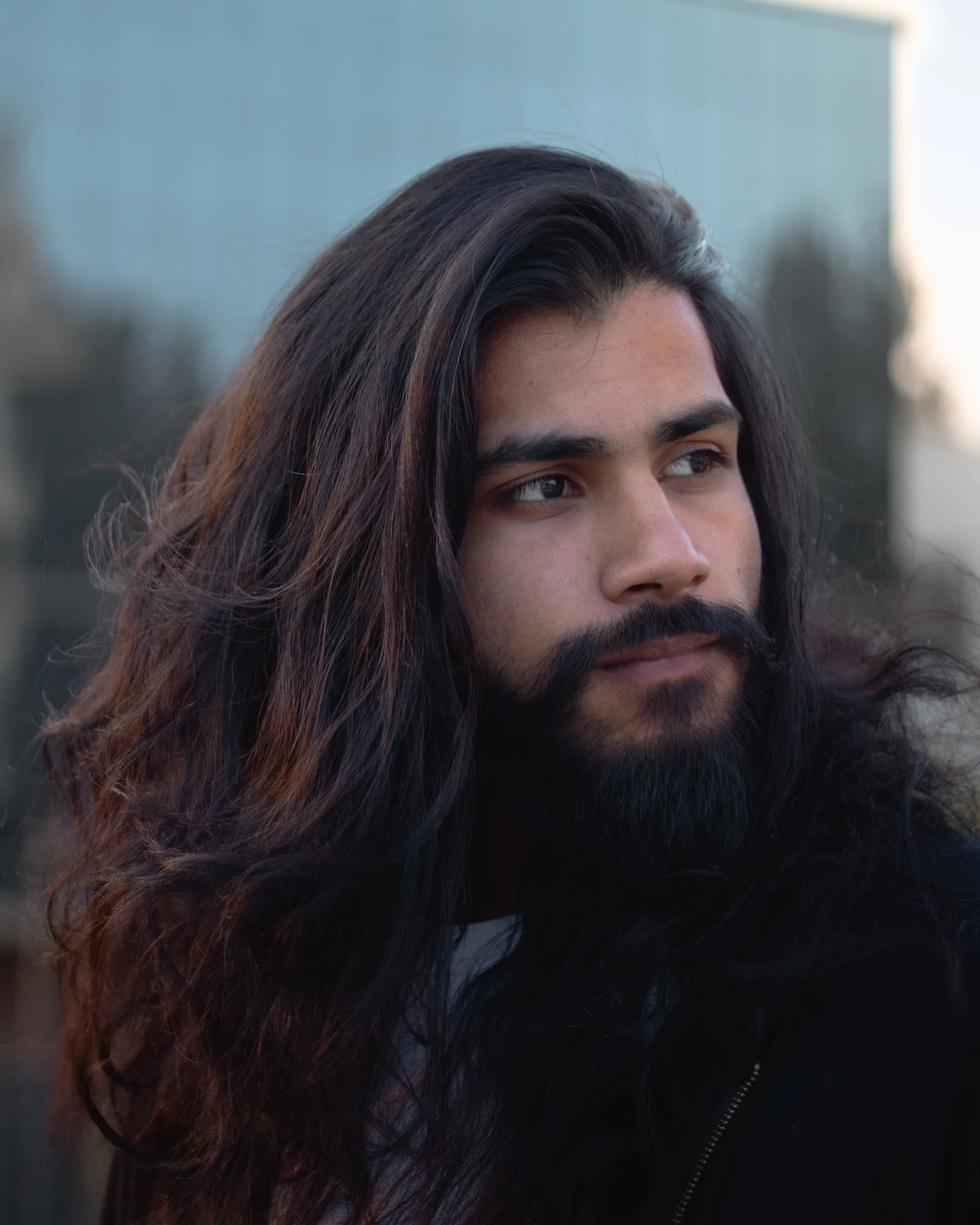 man with full beard and long black hair