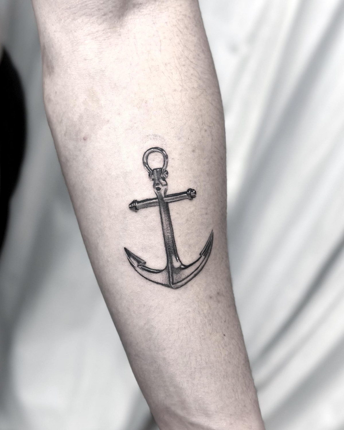 microrealism tattoo of an anchor