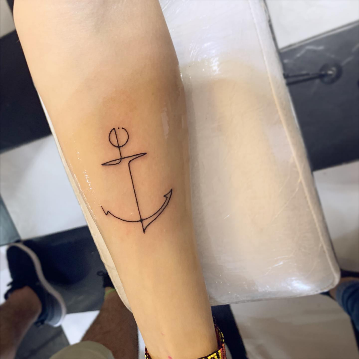 minimalistic one line anchor tattoo