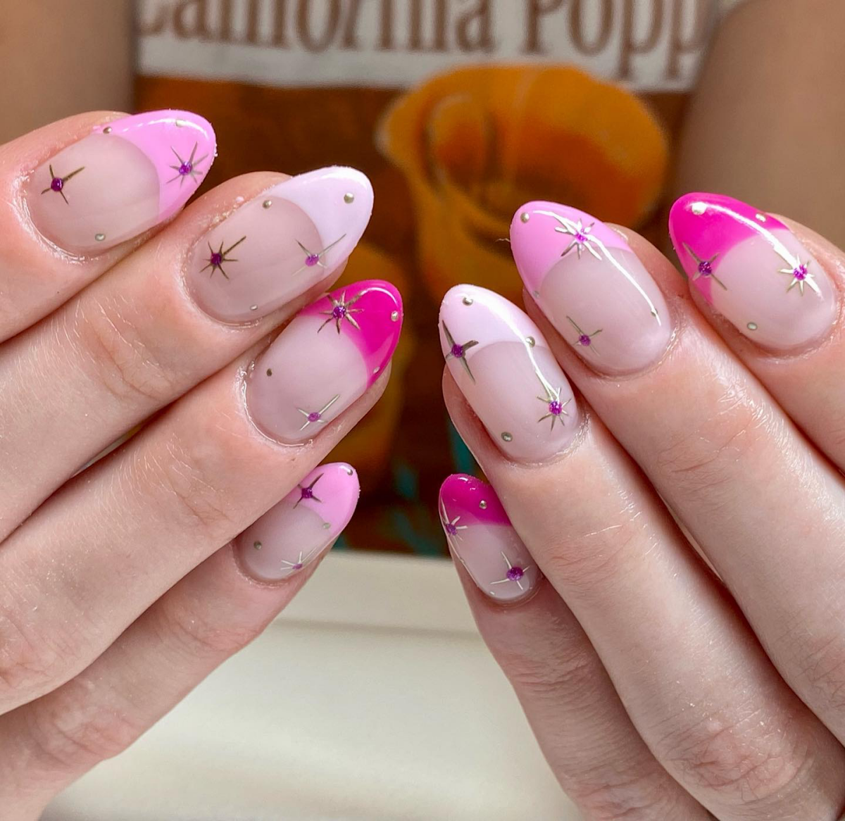 pink french tip nails with stars