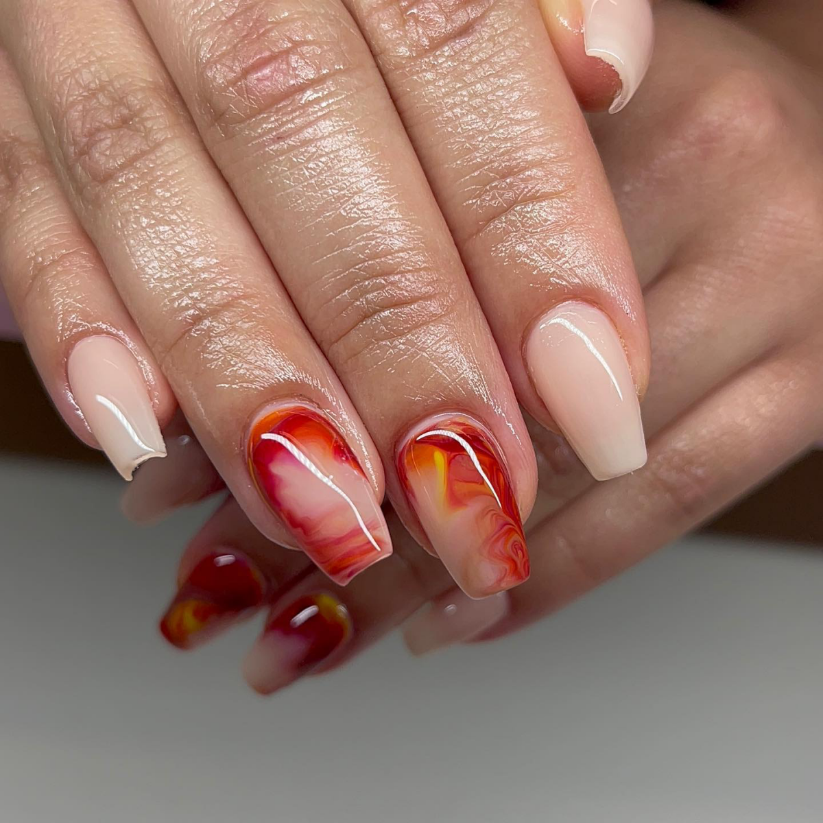 red and orange swirl nails