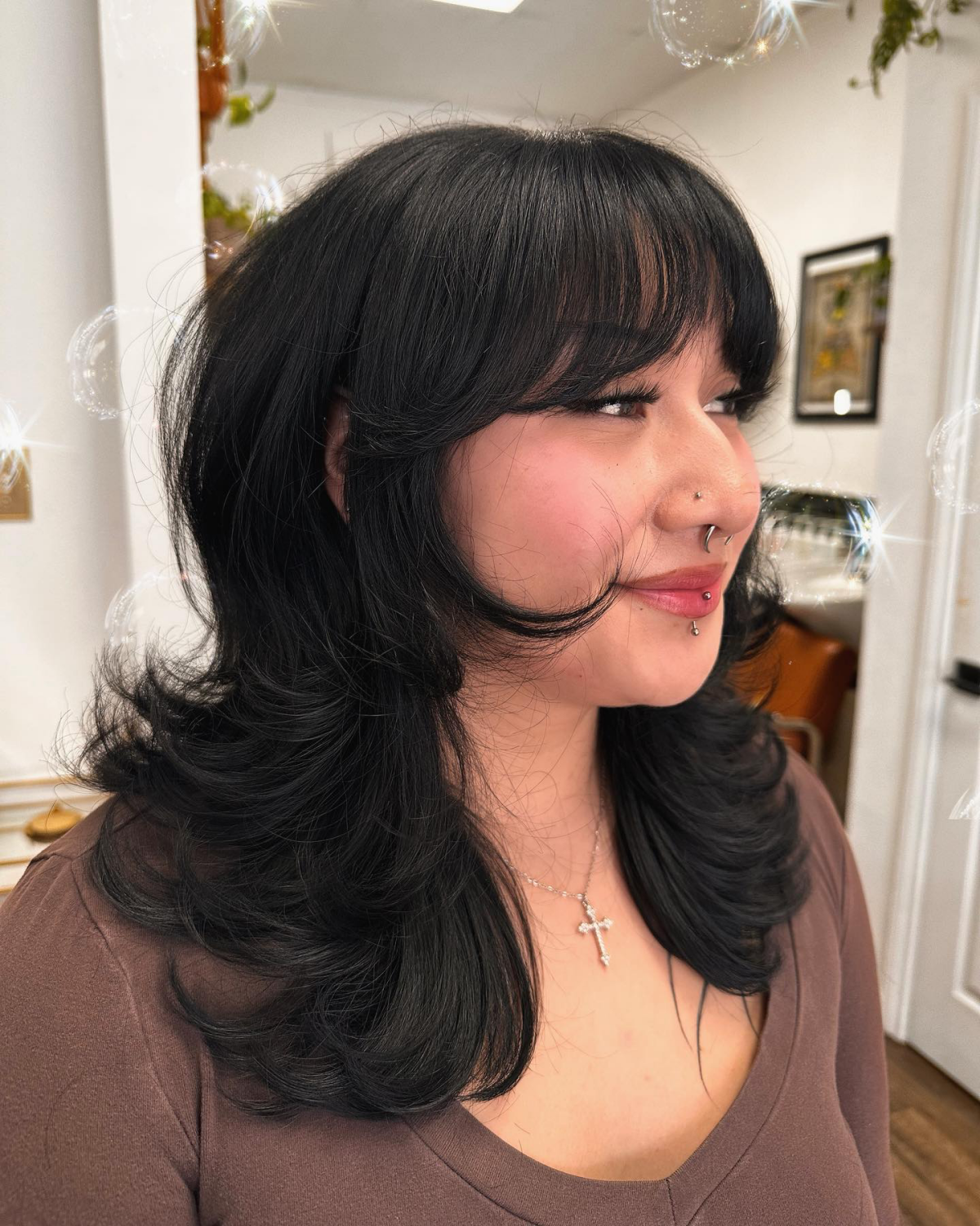shoulder length hair with butterfly bangs