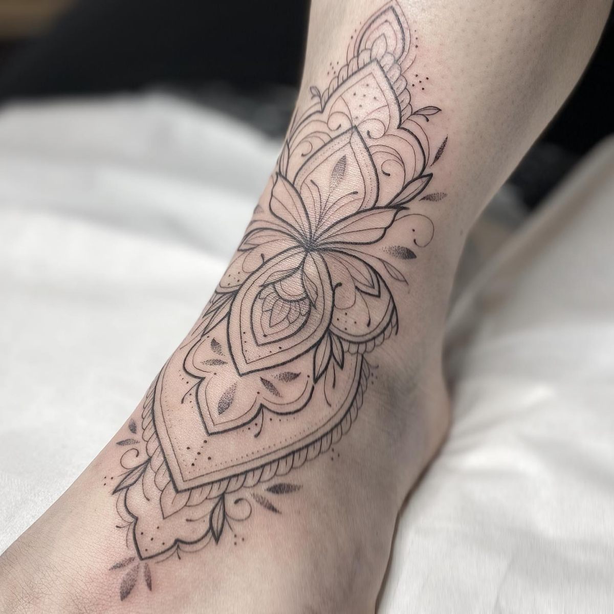 simple fine line tattoo for foot