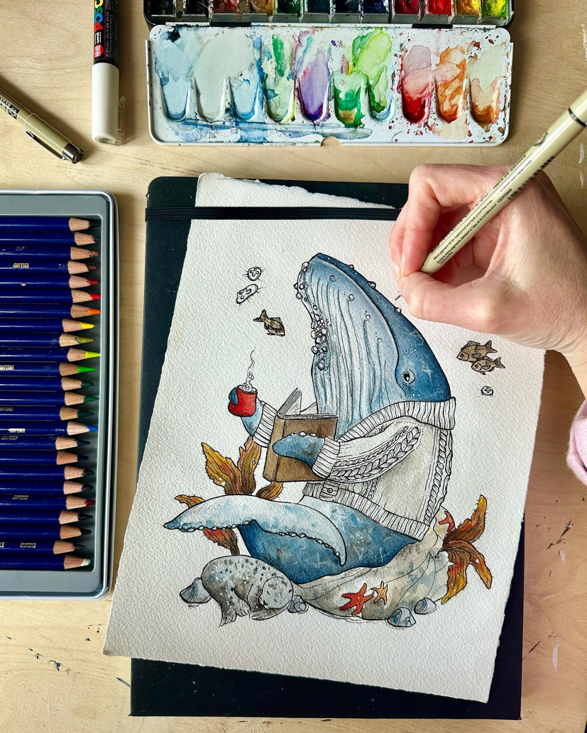 whale reading a book with a sweater drawing