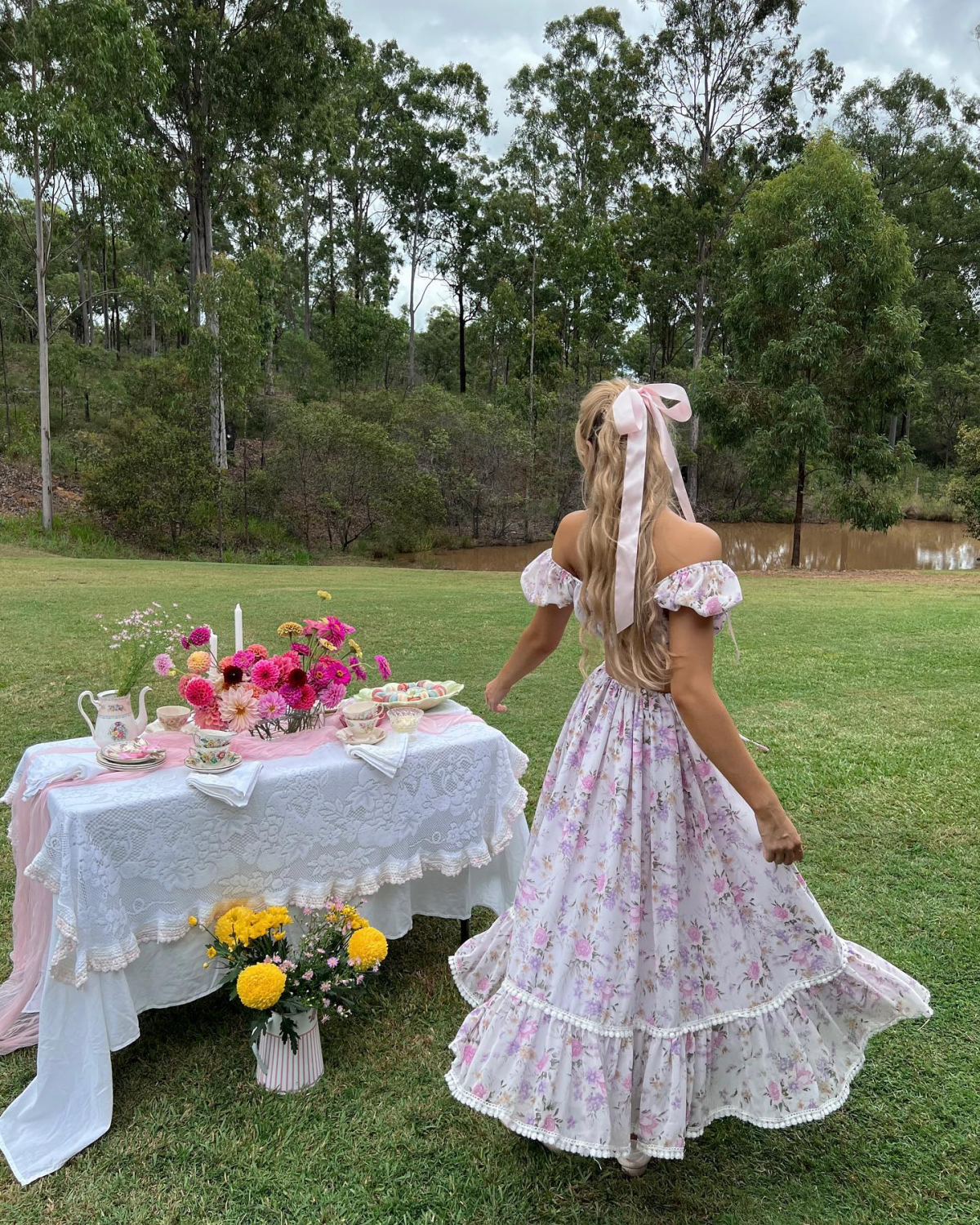 woman at a tea party with floral dress