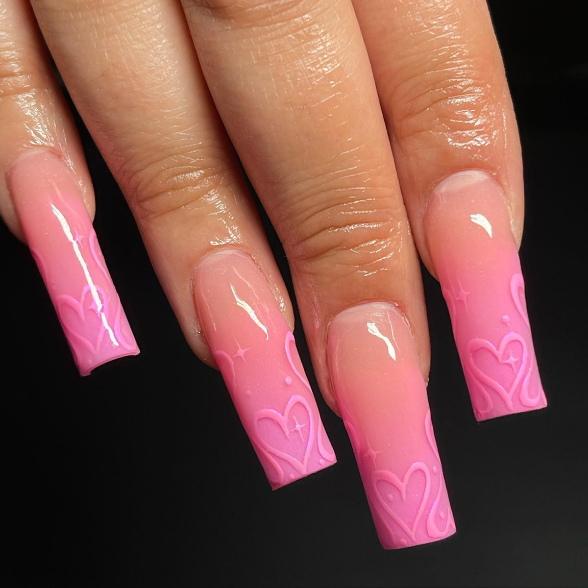 heart accents on pink ombre nails