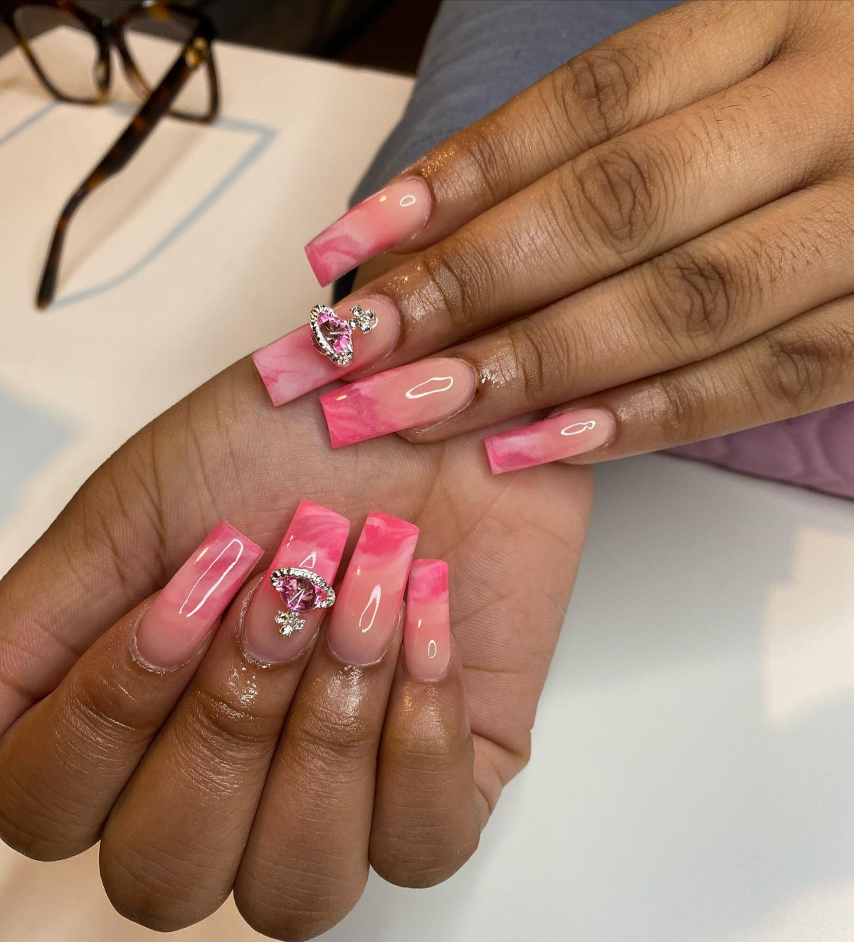 marble ombre nails with pink jewel