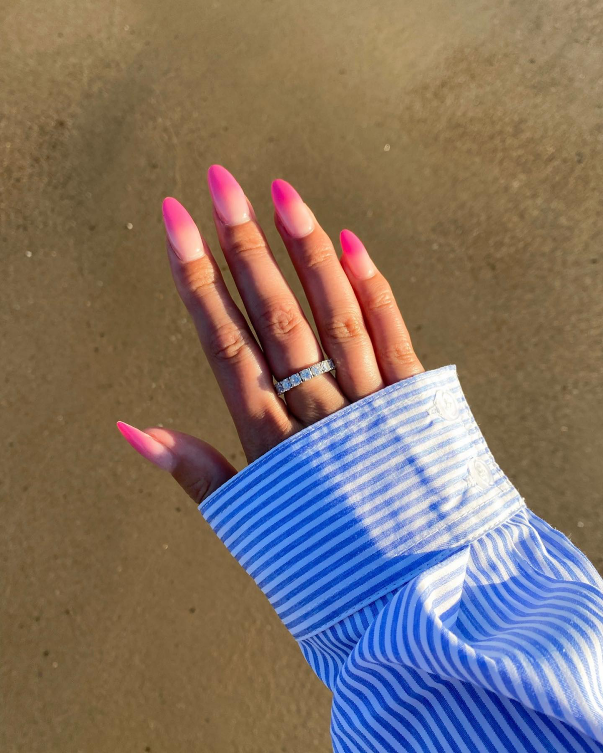 pink ombre nails on the beach