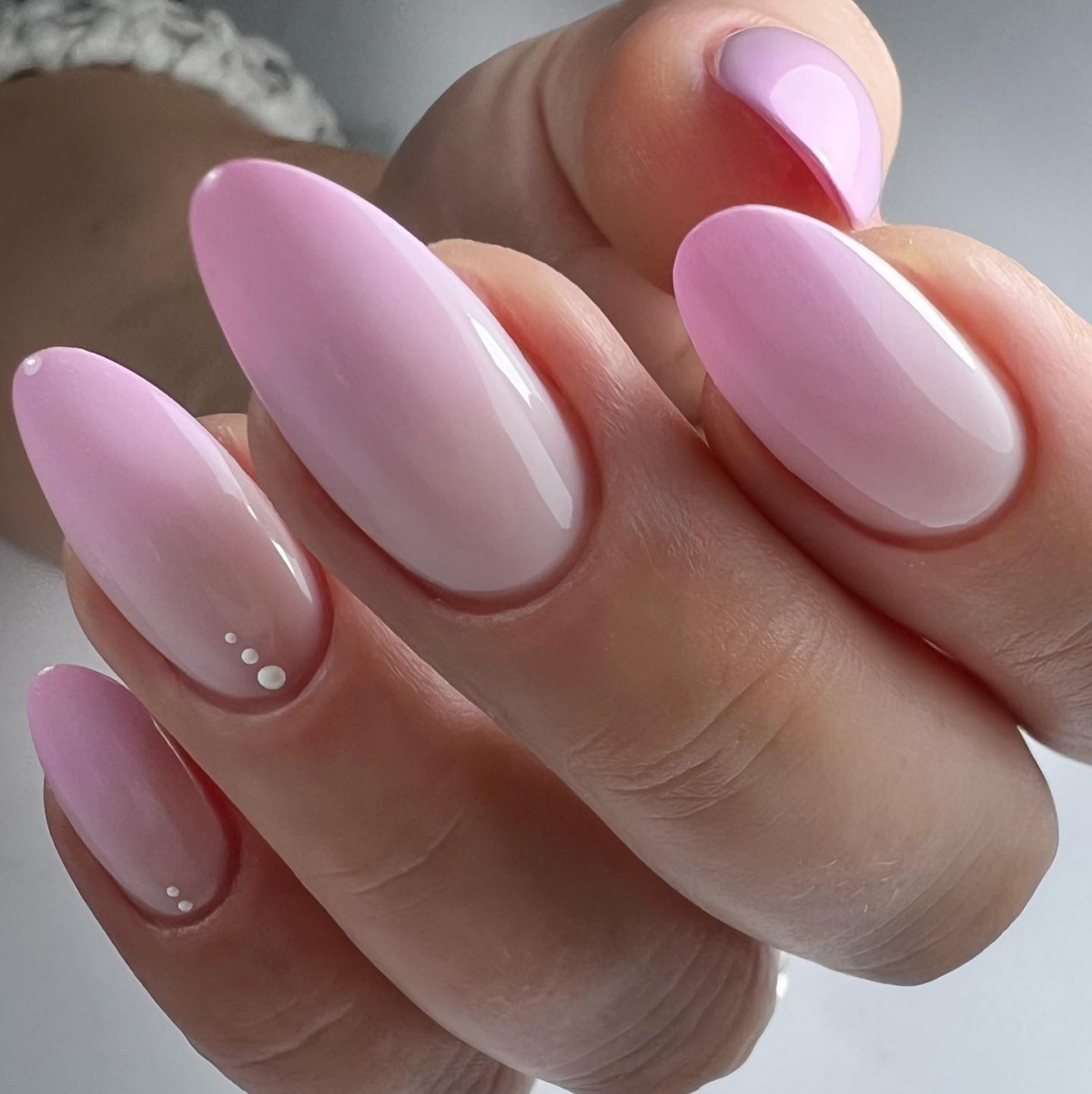 pink ombre nails with pearl gems