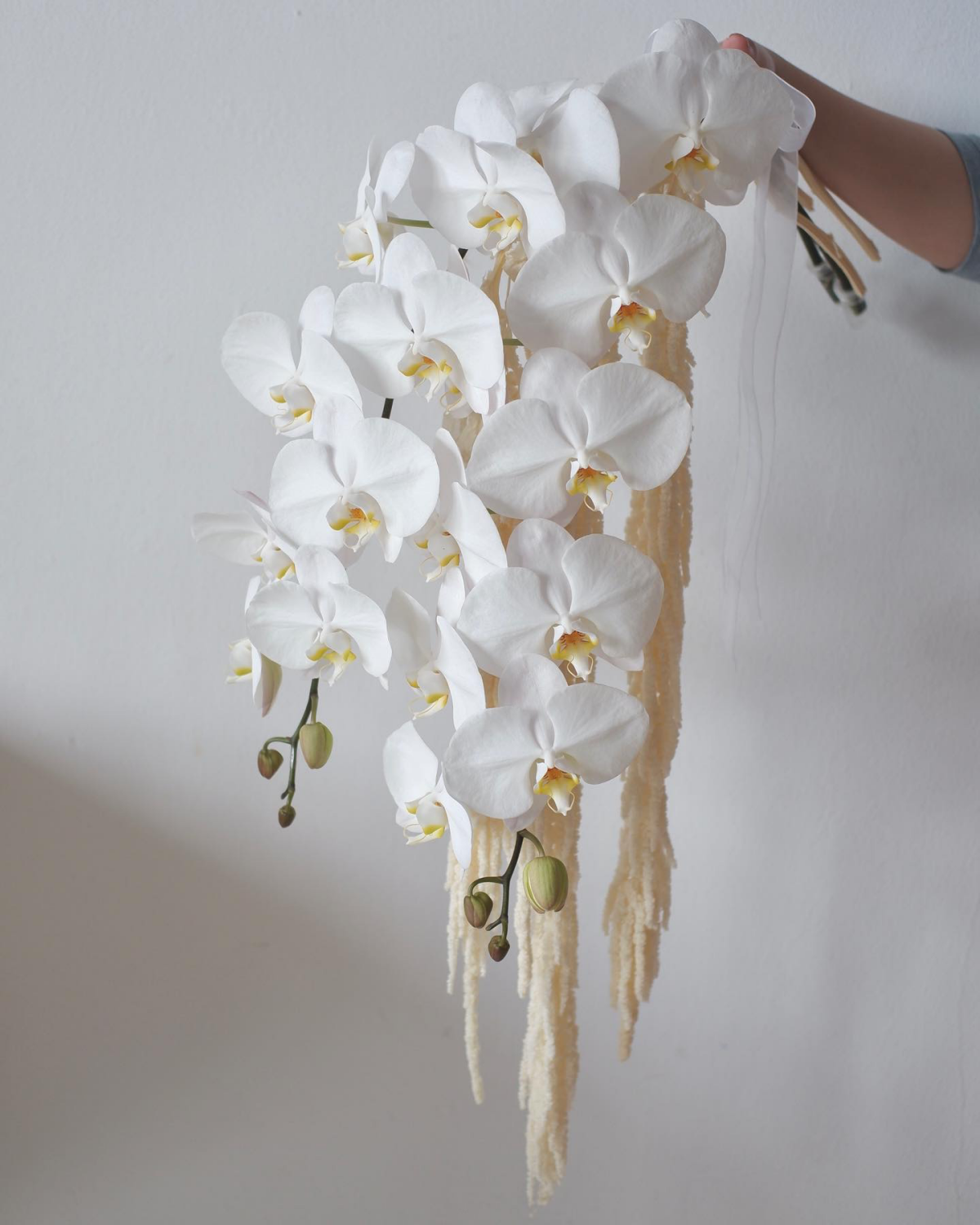 cascading white orchids in arrangement