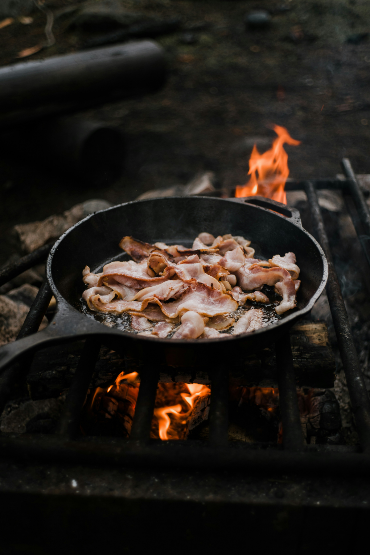 cooking bacon on a pan
