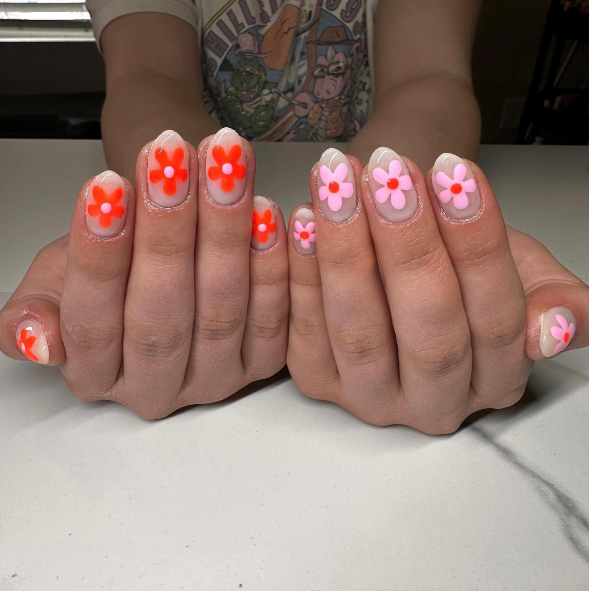 flowers pink and orange on nails